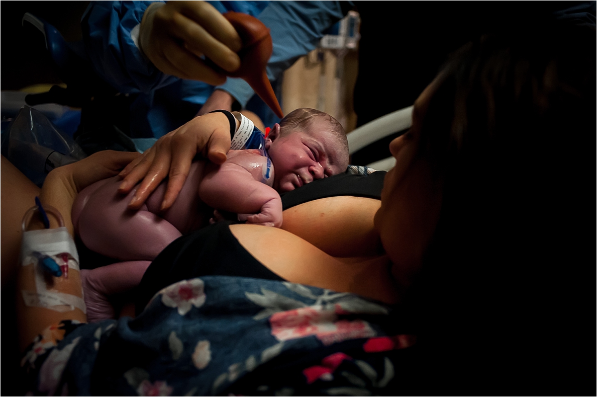 Mom holding newborn baby after birth at Kennestone Hospital in Marietta, GA