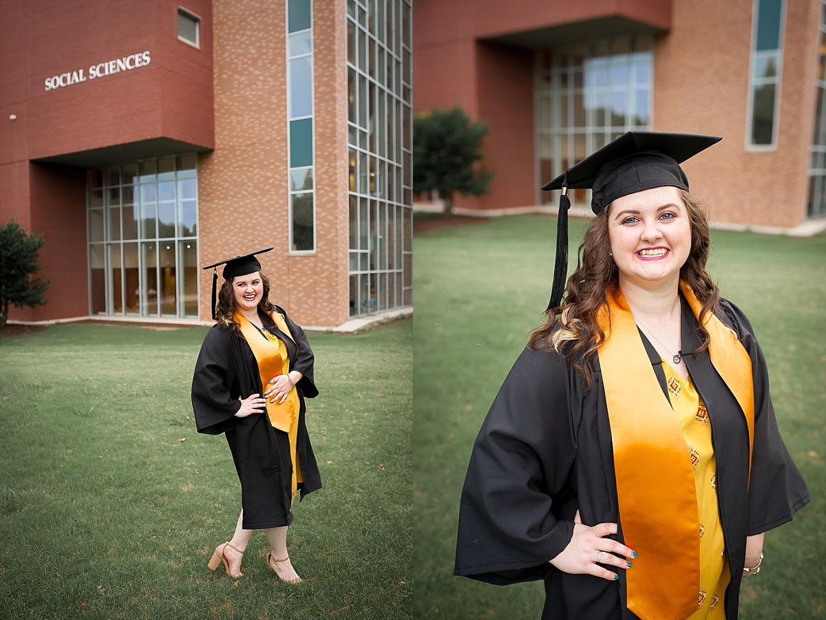 Smiling portrait of a Kennesaw State University graduate in front of the Social Sciences building during her KSU senior portrait photography session by Kennesaw senior photographer Amber Watson