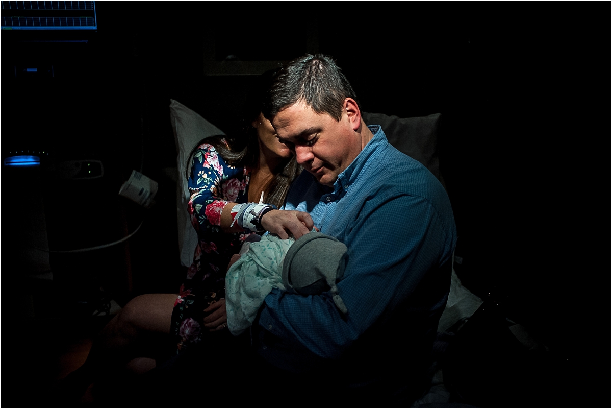 New parents holding a newborn baby at Kennestone Hospital in Marietta, GA