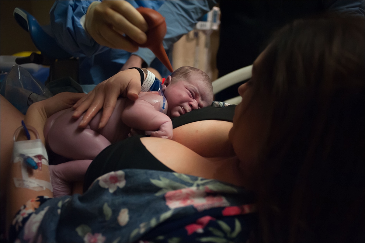 Mom holding newborn baby after birth at Kennestone Hospital in Marietta, GA